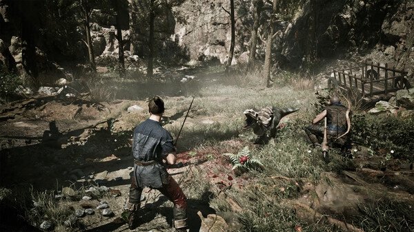 Gothic 1 Remake screenshot: Two characters engage a creature in a lush forest clearing, with a wooden bridge in the background.