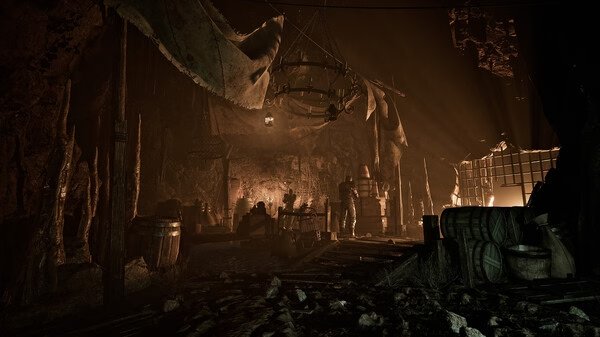 Gothic 1 Remake screenshot: A dimly lit cave interior with barrels, wooden structures, and a hanging chandelier casting shadows.