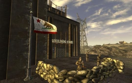Screenshot from Fallout: New Vegas showing soldiers guarding Helios One with a New California Republic flag in the foreground.