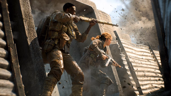 Battlefield™ 2042 screenshot: Two soldiers in combat gear emerge from cover amid smoke and debris during intense battle action.