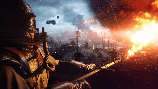 A Battlefield™ 1 screenshot showing a soldier in a gas mask using a flamethrower amidst a fiery, war-torn battlefield.