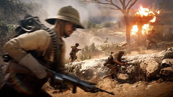 Battlefield™ 1 screenshot: Soldiers in World War I uniforms advance through a desert landscape amid explosions and gunfire.