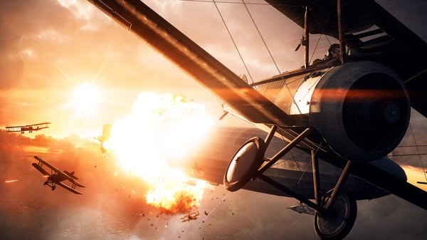 A Battlefield™ 1 screenshot showing WWI-era biplanes in an intense aerial battle with explosions and a dramatic sunset.