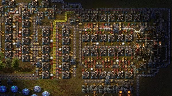 Factorio screenshot showing a complex factory setup with conveyor belts, assemblers, and machines producing items.