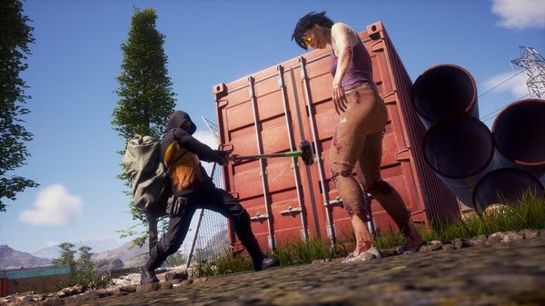 A screenshot from State of Decay 2: Juggernaut Edition showing a survivor with a sledgehammer facing a zombie near shipping containers.