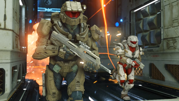 Halo Infinite screenshot: Two armored Spartans running through a futuristic corridor with explosions in the background.