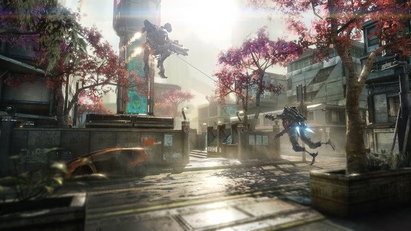 Titanfall® 2 screenshot: Two Titans engage in combat amidst a sunlit urban landscape with cherry blossom trees.