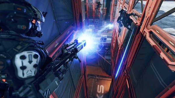 Titanfall® 2 screenshot: A pilot in futuristic armor fires a beam weapon at an enemy in a narrow corridor, with blue energy effects visible.