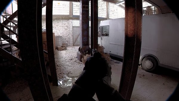 Screenshot from Unrecord showing a first-person view inside a warehouse with a gun aimed at a white van.