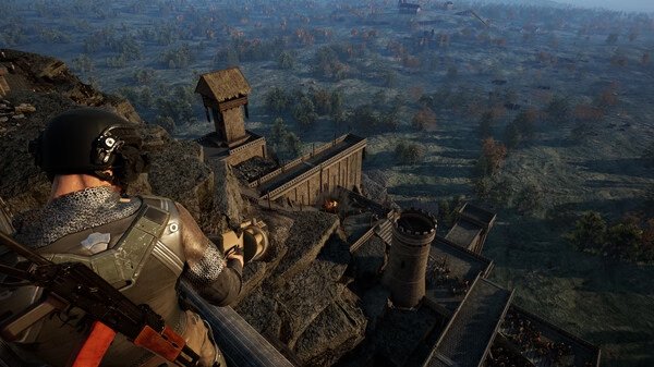 Screenshot from Kingmakers: A character in tactical gear observes a castle surrounded by lush countryside from a high vantage point.