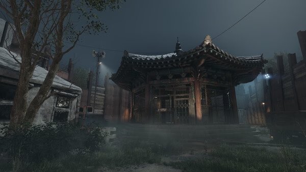 Screenshot from NAKWON: LAST PARADISE showing a misty scene with a traditional Korean building surrounded by trees.