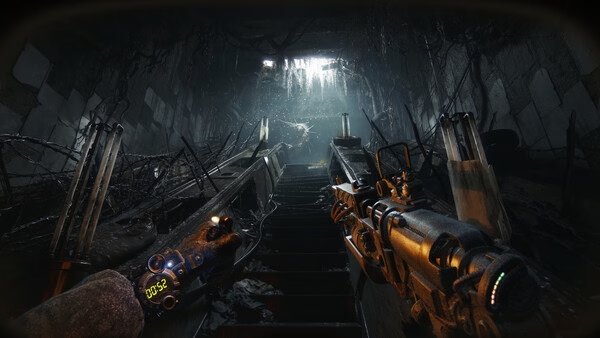 METRO 2039 screenshot: A player holds a rifle while ascending a dark, debris-filled staircase in an abandoned underground tunnel.