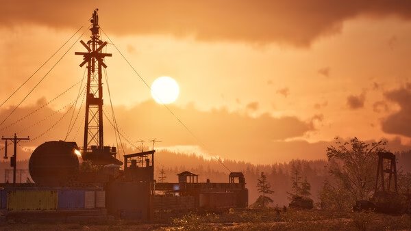 State of Decay 3 screenshot: A serene sunset over an industrial site, featuring a large tower and scattered buildings in the foreground.
