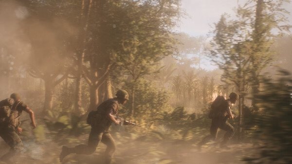 Hell Let Loose: Vietnam screenshot showing soldiers advancing through a dense jungle under hazy sunlight.