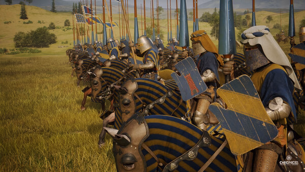 Knights on horseback with blue and gold banners line up on a grassy battlefield in this Chronicles: Medieval screenshot.