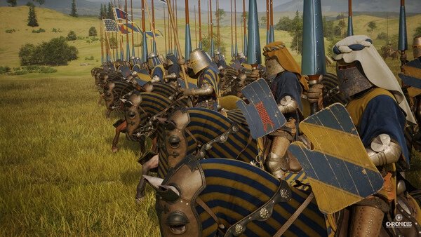 Knights on horseback with blue and gold banners line up on a grassy battlefield in this Chronicles: Medieval screenshot.