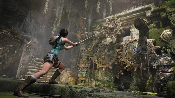 Screenshot from Tomb Raider: Legacy of Atlantis showing Lara Croft interacting with ancient, intricate gear mechanisms.