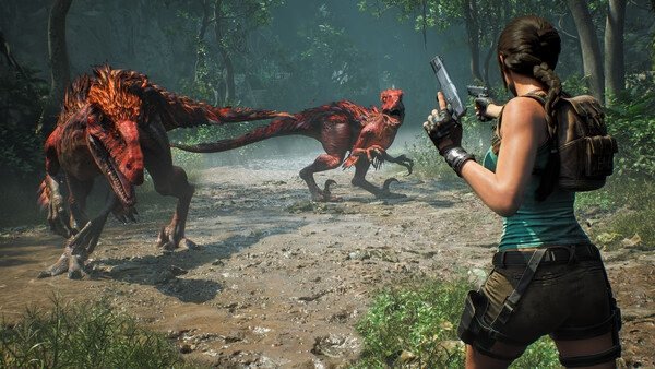 Tomb Raider: Legacy of Atlantis screenshot shows Lara Croft aiming a gun at two dinosaur-like creatures in a dense forest setting.