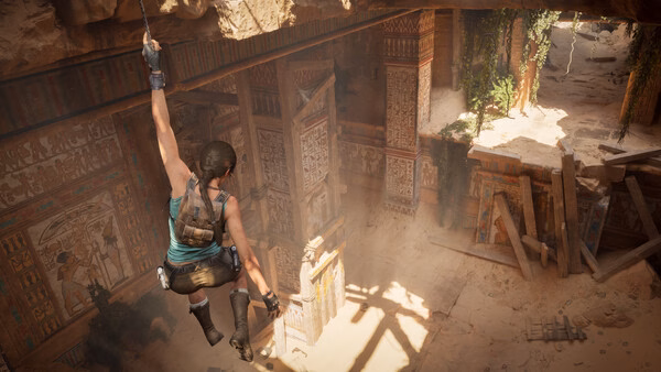 Screenshot from Tomb Raider: Legacy of Atlantis showing the protagonist hanging from a rope in an ancient, sunlit temple.
