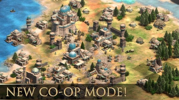 Age of Empires II screenshot showing a coastal town with buildings, trees, and units, highlighting the new co-op mode feature.