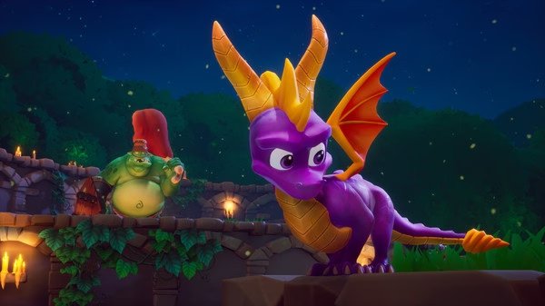 Spyro Reignited Trilogy screenshot: Spyro stands on a stone platform at night, with a large green enemy in the background.
