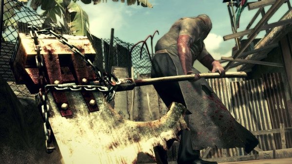 Resident Evil 5 screenshot: A menacing figure wields a large axe in a gritty outdoor setting, surrounded by metal fences and debris.