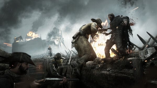 Screenshot from Hunt: Showdown 1896 showing intense combat with hunters in a trench, one aiming a gun, amidst a fiery battlefield.