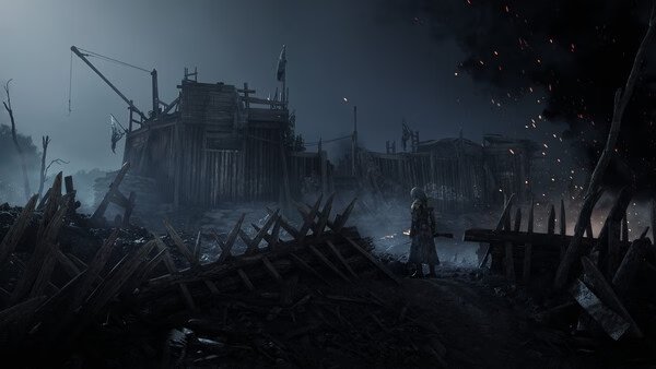 A Hunt: Showdown 1896 screenshot showing a lone hunter standing before a dark, wooden fort surrounded by debris and glowing embers.