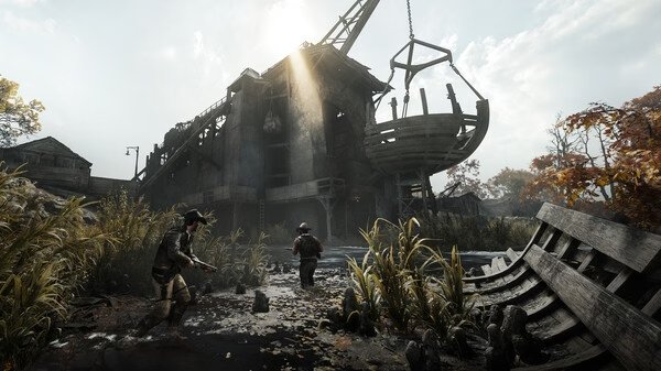 Screenshot from Hunt: Showdown 1896 showing two players navigating a swamp near a rundown building under a bright sky.