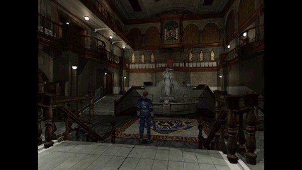 A screenshot from Resident Evil 2 (1998) showing the main hall of the Raccoon Police Department with a statue and stained glass windows.