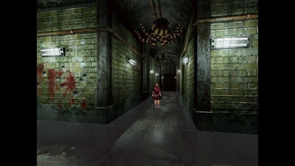 Resident Evil 2 (1998) screenshot: A character stands in a dimly lit corridor as a giant spider hangs from the ceiling above.