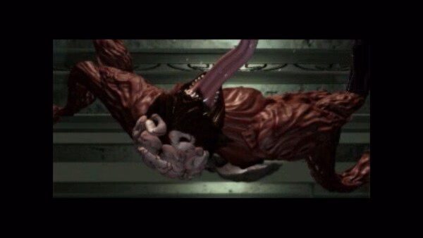 Screenshot from Resident Evil 2 (1998) showing a mutated creature with exposed muscles and sharp claws in a dimly lit environment.