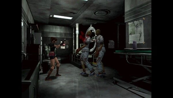 Resident Evil 2 (1998) screenshot: A character aims a pistol at two approaching zombies in a dimly lit lab.
