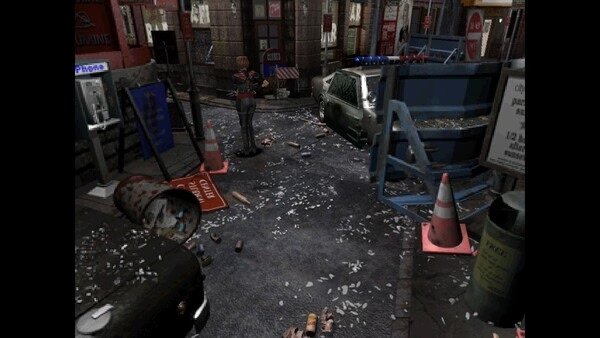 Screenshot from Resident Evil 3 Nemesis (1999) showing a street scene with debris, barricades, and a character standing.