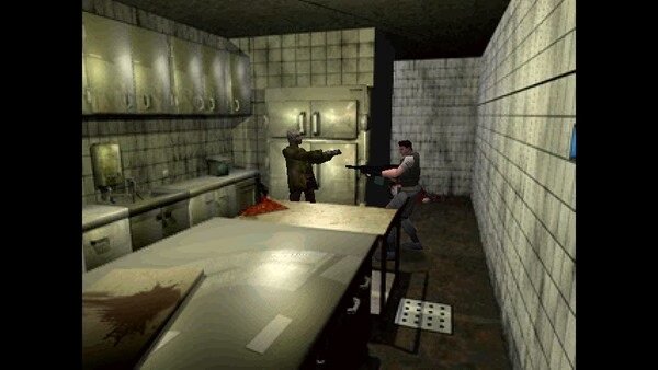 Resident Evil (1996) screenshot: A tense standoff in a dimly lit kitchen as two characters aim weapons at each other.