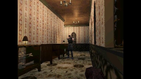 Screenshot from Resident Evil (1996) showing a character in a dimly lit room, aiming a gun down a wallpapered hallway.