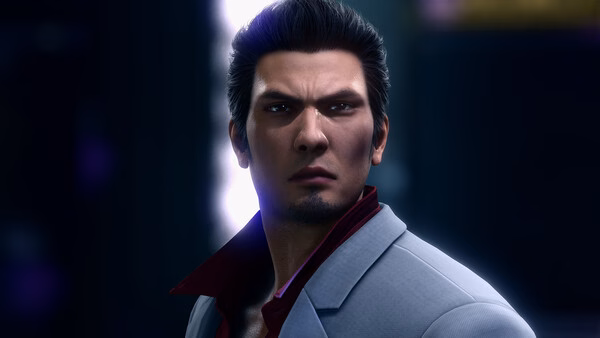 A Yakuza Kiwami 2 screenshot featuring a man in a gray suit with a red shirt collar, set against a dark, glowing backdrop.