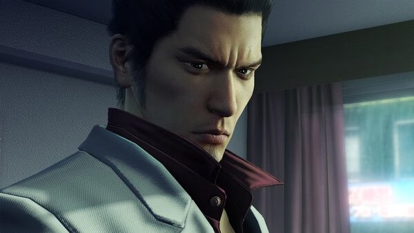 Screenshot from Yakuza Kiwami showing a character in a white suit standing indoors near a window with curtains.