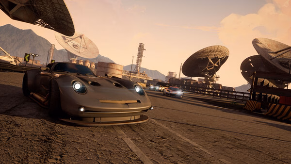 Screamer screenshot: A sleek sports car speeds on a race track with satellite dishes and mountains in the background.