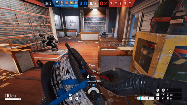 Screenshot from Tom Clancy's Rainbow Six Siege showing a player deploying barbed wire inside a room, with teammates preparing defenses.
