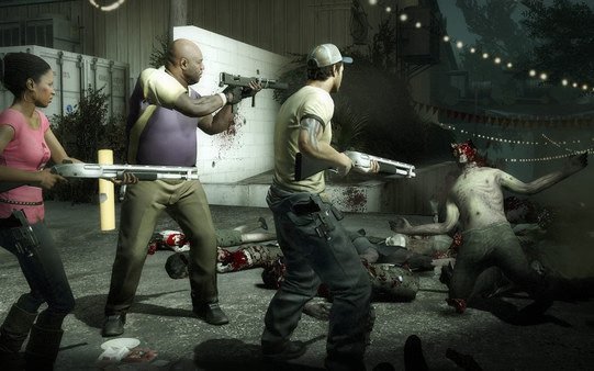 Left 4 Dead 2 screenshot: Survivors battle zombies at night, using shotguns amidst a backdrop of string lights and a bloodstained street.