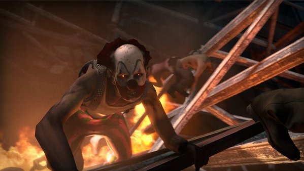 Left 4 Dead 2 screenshot: A zombie clown crawls aggressively, surrounded by flames and debris, in a chaotic scene.