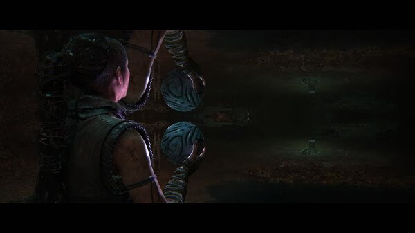 Hellblade II: Senua’s Saga screenshot showing Senua holding a carved sphere, facing a dark, eerie environment with mirrored elements.