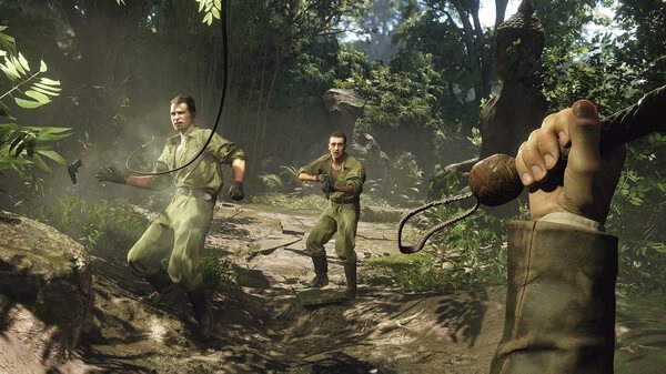 Screenshot of "Indiana Jones and the Great Circle" showing two explorers in a lush jungle, one holding a whip in hand.