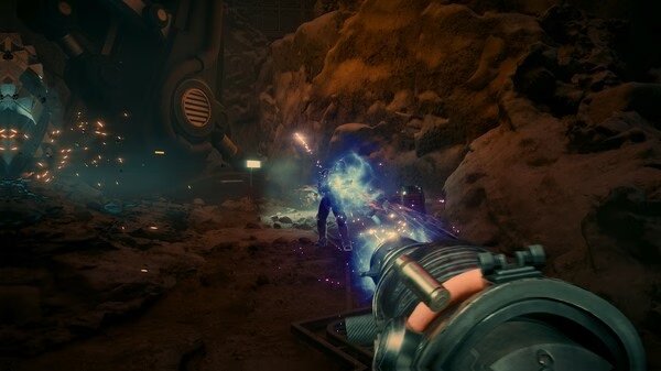 Screenshot from The Outer Worlds 2 showing a player firing a blue energy weapon at an enemy in a rocky cavern.