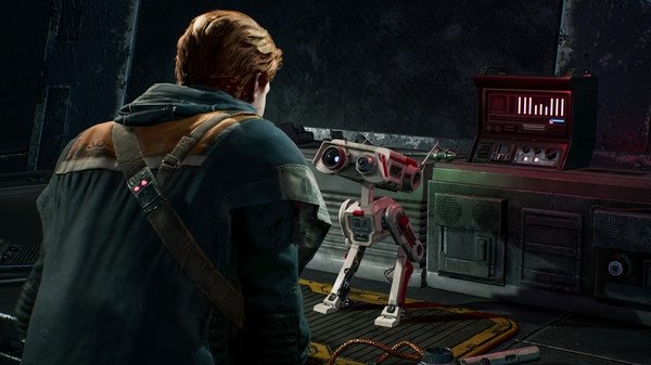Screenshot from STAR WARS Jedi: Fallen Order showing Cal Kestis interacting with the droid BD-1 in a dimly lit spaceship interior.