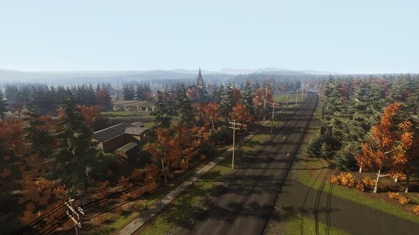VEIN screenshot: A scenic view of a rural town with roads and houses surrounded by autumn-colored trees under a clear sky.