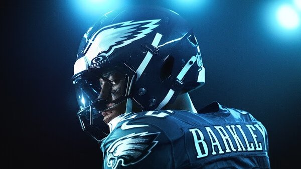EA SPORTS Madden NFL 26 screenshot featuring a close-up of a player in an Eagles uniform under stadium lights, helmet labeled "Barkley."
