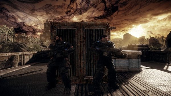 Gears of War: Reloaded screenshot showing two armored soldiers taking cover behind a crate on a battle-scarred bridge at sunset.