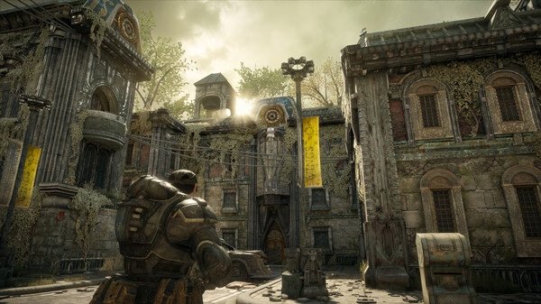 Screenshot from Gears of War: Reloaded showing an armored soldier standing in a sunlit, overgrown courtyard.